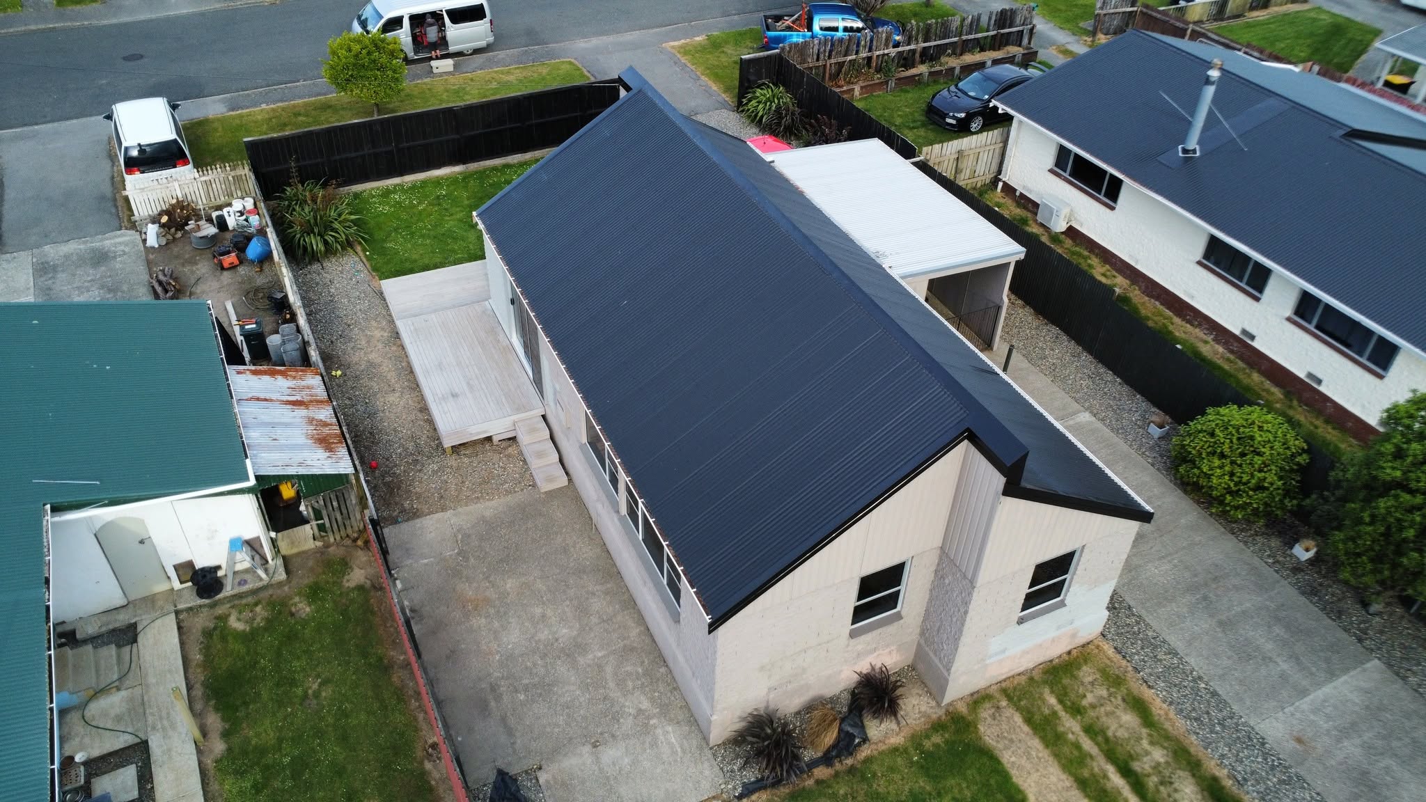 A completed black metal roof photographed from above in Southland